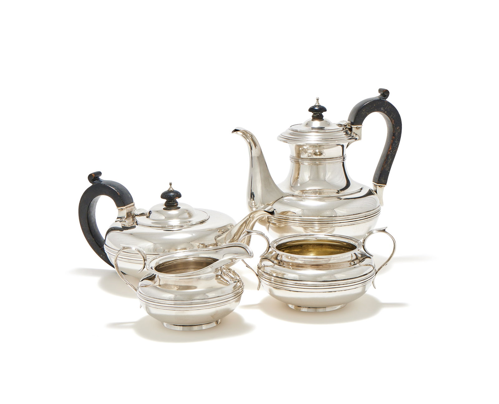 A SILVER FOUR PIECE TEA AND COFFEE SET, CARRINGTON & CO., LONDON 1957 (1 of 2)