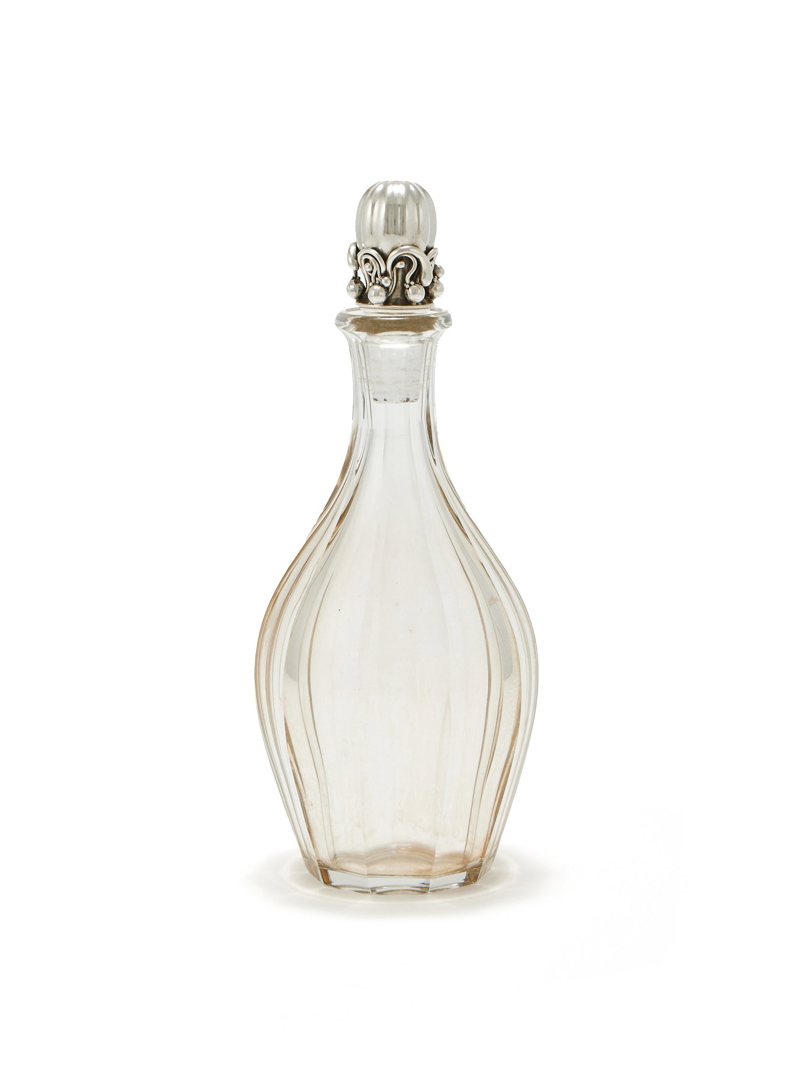 BACCARAT, A GLASS DECANTER WITH A SILVER STOPPER BY GEORG JENSEN LTD. (1 of 2)