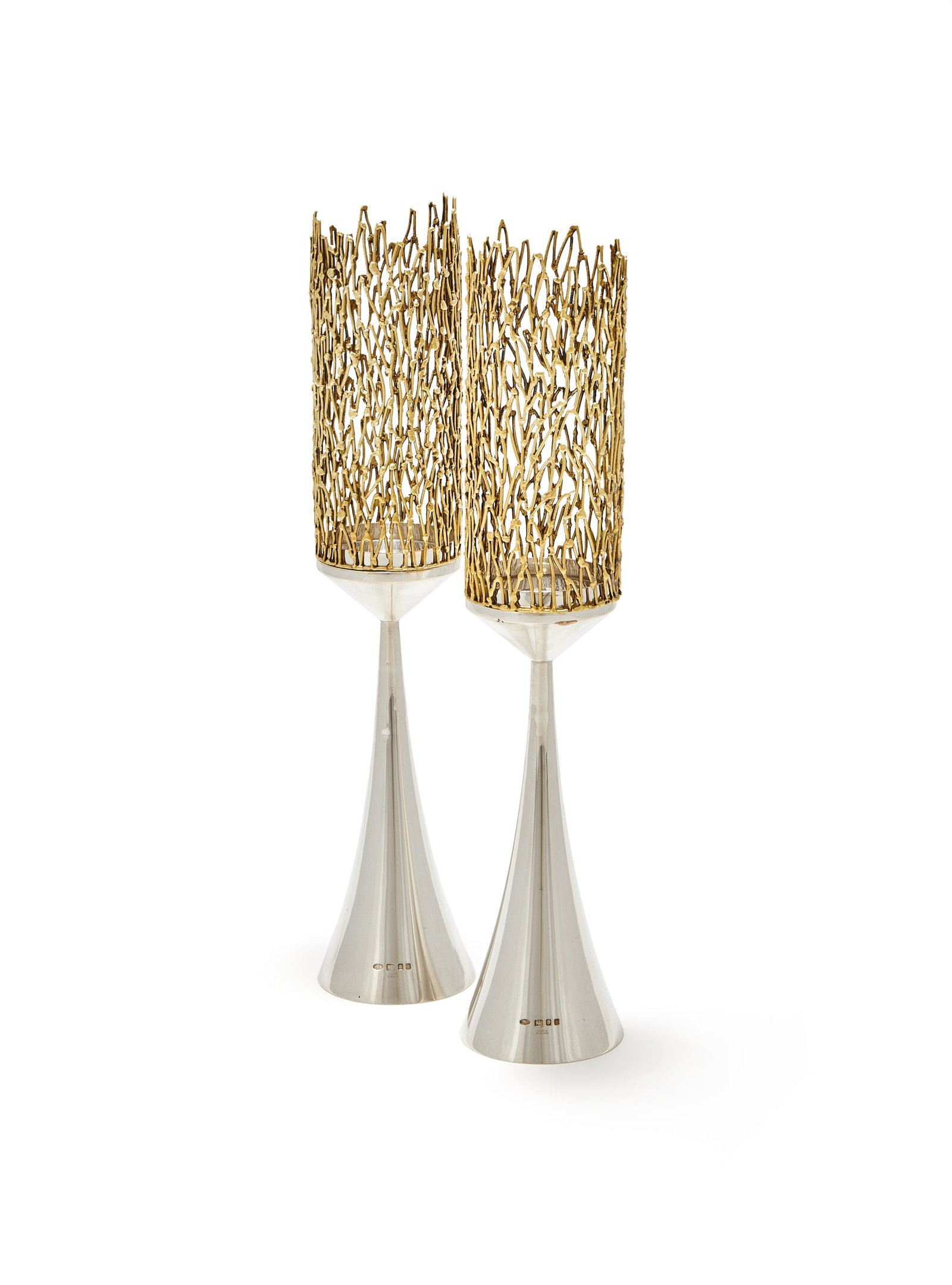 STUART DEVLIN, A PAIR OF SILVER AND SILVER GILT TRUMPET SHAPED CANDLESTICKS, LONDON 1972: STUART DEVLINA PAIR OF SILVER AND SILVER GILT TRUMPET SHAPED CANDLESTICKS, LONDON 1972With silver gilt filigree shades and trumped shaped bodies36.5cm high854g (27.45 oz)Provenance:A Private Collectio