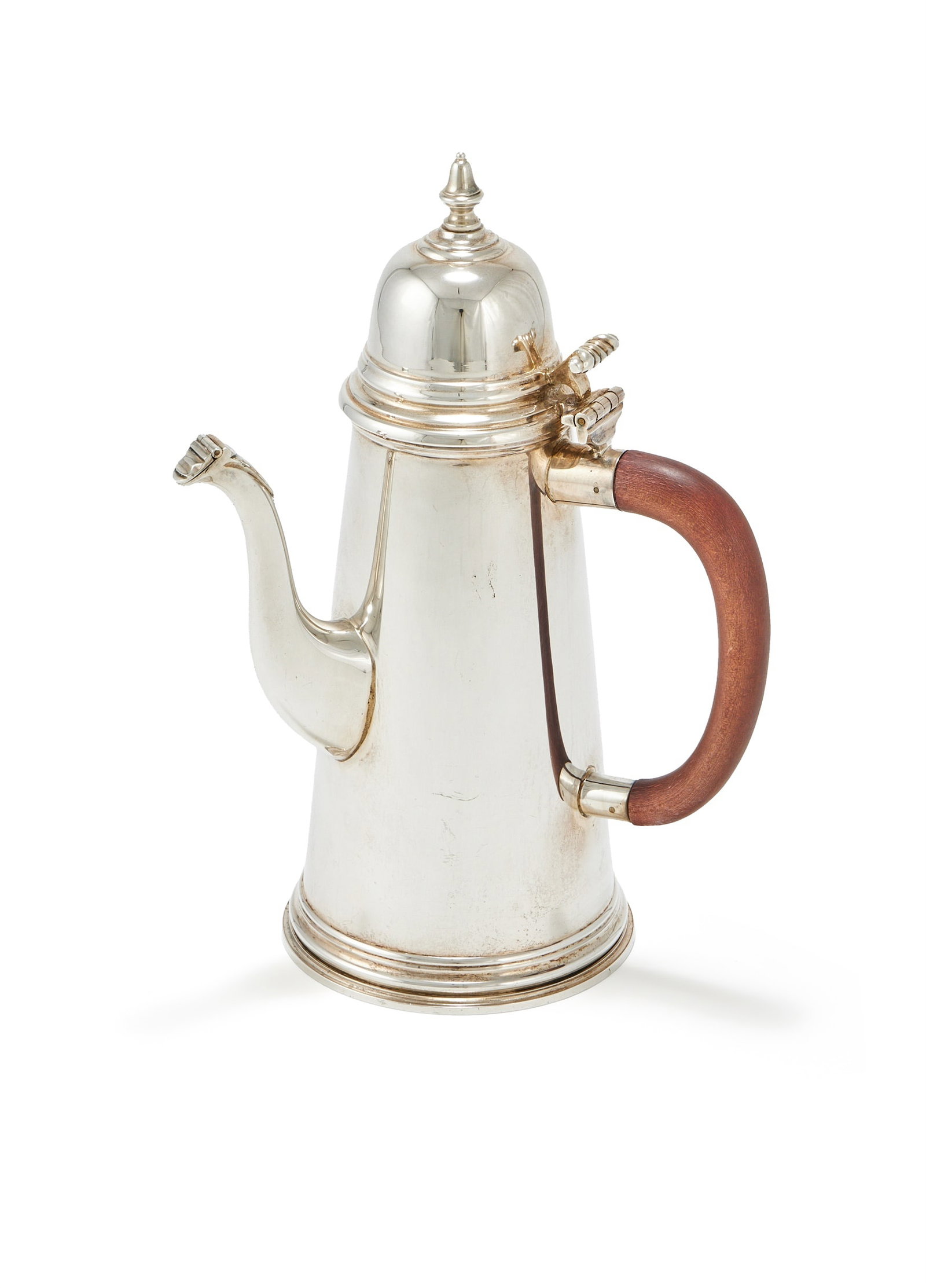 A SILVER TAPERING COFFEE POT, RICHARD COMYNS, LONDON 1970: A SILVER TAPERING COFFEE POTRICHARD COMYNS, LONDON 1970With a bell shaped finial to the domed cover, a scroll thumb piece and a wood loop handle26.5cm high824g (26.5 oz) gross