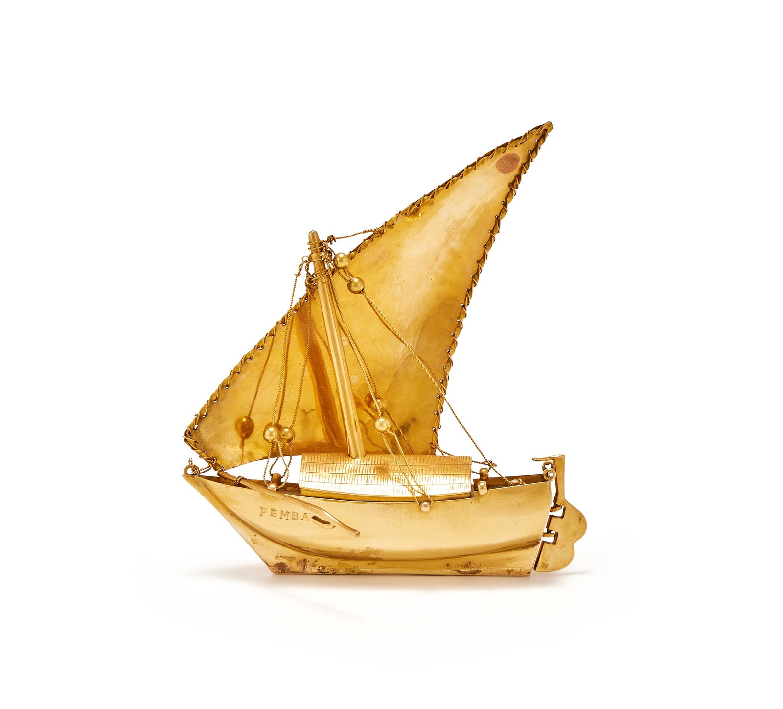 A GOLD COLOURED MODEL OF A DHOW, UNMARKED: A GOLD COLOURED MODEL OF A DHOWUNMARKEDEngraved PEMBA12cm long109g