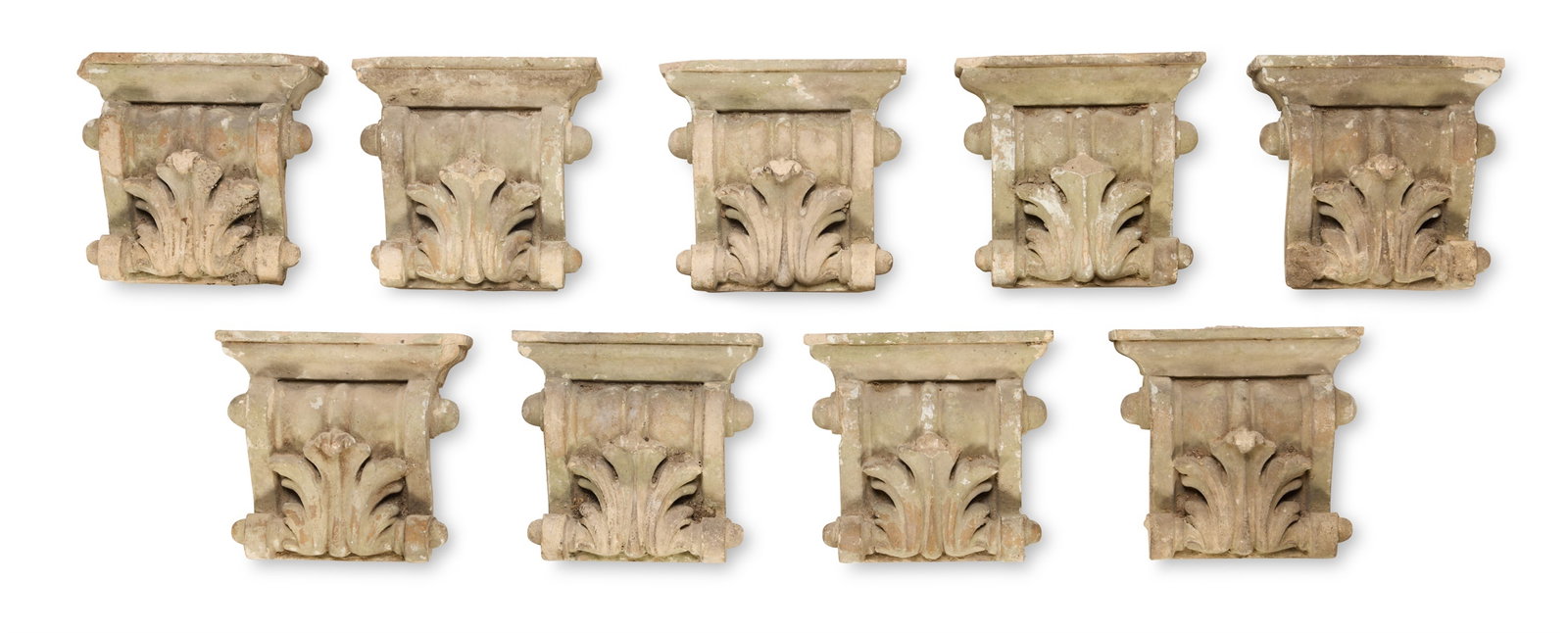 A SET OF NINE COMPOSITION STONE CORBELS, LATE 19TH CENTURY (1 of 3)