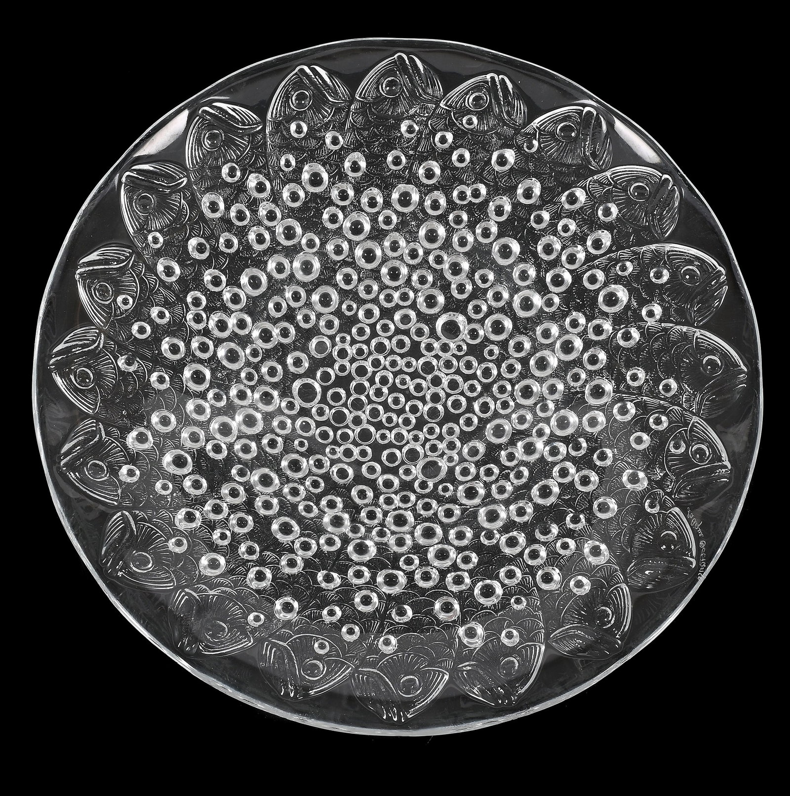 RENÉ LALIQUE (FRENCH, 1860-1945), 'ROSCOFF' DISH, DESIGNED IN 1932, LATE 20TH CENTURY: RENÉ LALIQUE (FRENCH, 1860-1945)'ROSCOFF' DISH, DESIGNED IN 1932, LATE 20TH CENTURYClear glass with bubbles and radiating fishSigned 'Lalique France'36cm diameterLiterature:Félix Marcilhac, 