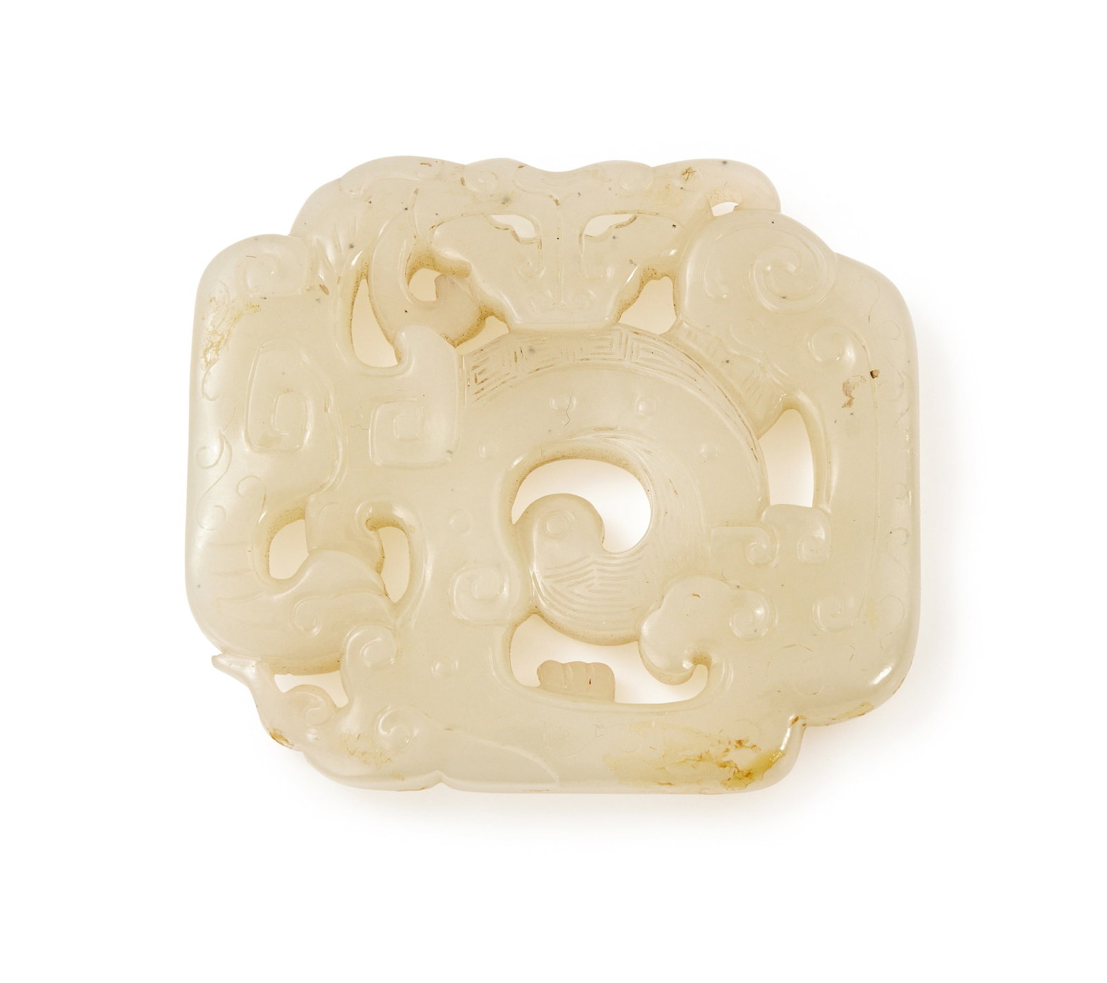 A fine Chinese white jade 'dragon' pendant, Qing dynasty, 18th century: A fine Chinese white jade 'dragon' pendantQing dynasty, 18th centurywell carved to each side with a coiled dragon with carved scrolls and incised details, with small russet inclusions5.7cmm high x 6.5