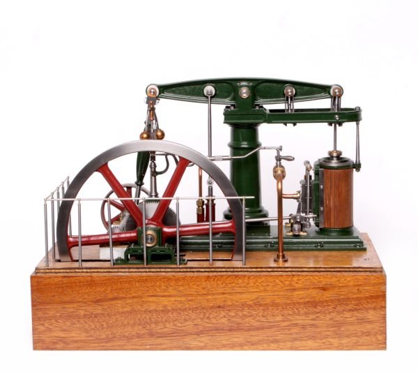 An exhibition standard model of an M E Beam engine: An exhibition standard model of an M E Beam engine, the beam supported on a turned central column with fitted water pump, inside steam valve with brass oilers to the vertical wooden clad single cylind