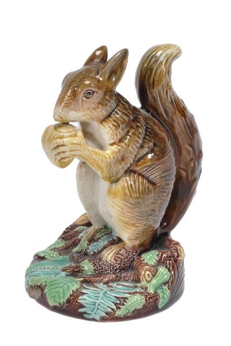 A George Jones majolica model of a squirrel eating: A George Jones majolica model of a squirrel eating a nut, seated on its haunches on a naturalistic base, 12.5cm high, circa 1870