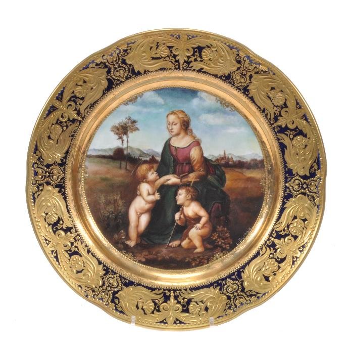 A Vienna style cabinet plate painted with the Mado: A Vienna style cabinet plate painted with the Madonna and Child and St. John the Baptist, after Raphael, elaborate gilt border, signed L. Gurkna, blue shield mark