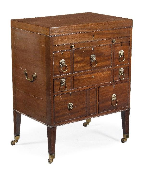 A George III mahogany gentlemens dressing table ,:  A George III mahogany gentlemens dressing table, circa 1790, hinged lid, opening to a fitted interior, incorporating divisions and centred by a ratchet adjustable mirror, above a slide with a ba