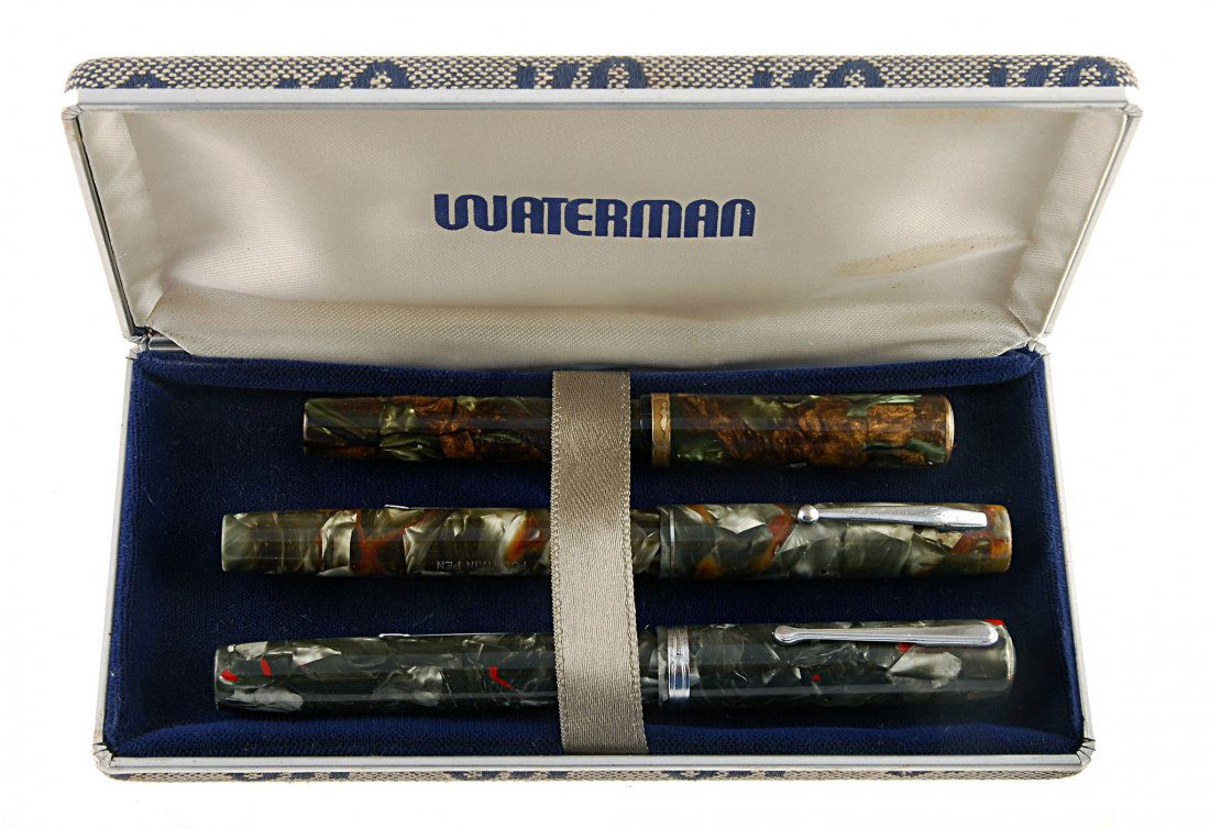 Waterman, three lever fill fountain pens , all ink: Waterman, three lever fill fountain pens , all inked, comprising: A Lady Patricia, circa 1930, with bronze and green marbled barrel and cap, Nib size 2, with monogrammed cap crown; Ideal, circa 1930,