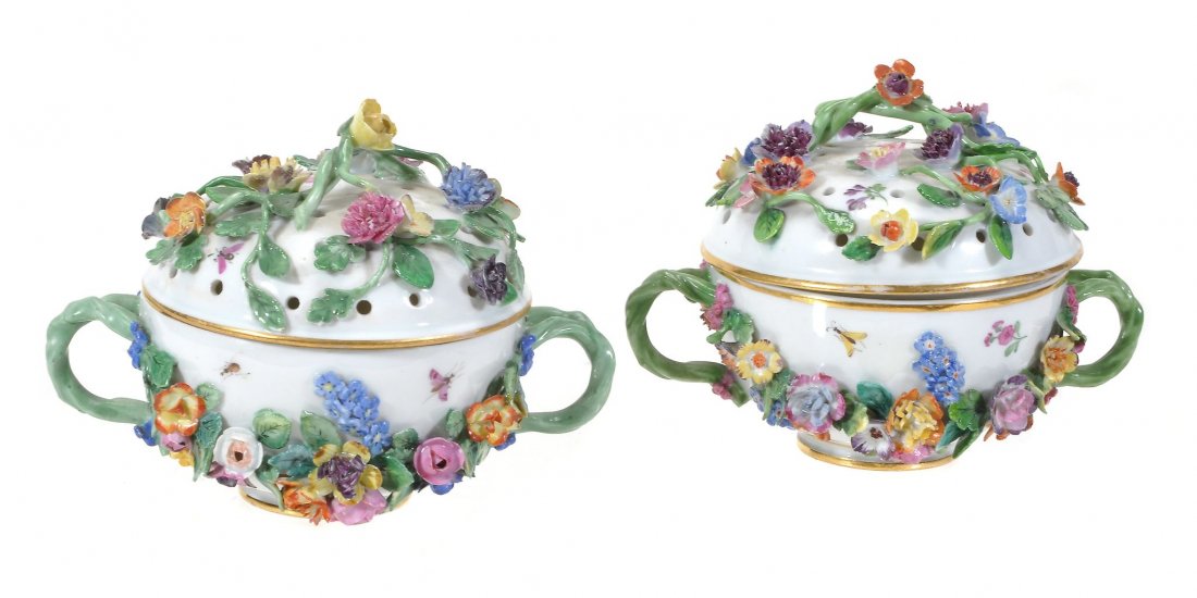 A pair of Meissen flower-encrusted two-handled: A pair of Meissen flower-encrusted two-handled pot-pourri urns and pierced covers, 13cm wide, blue crossed swords marks, late 19th century