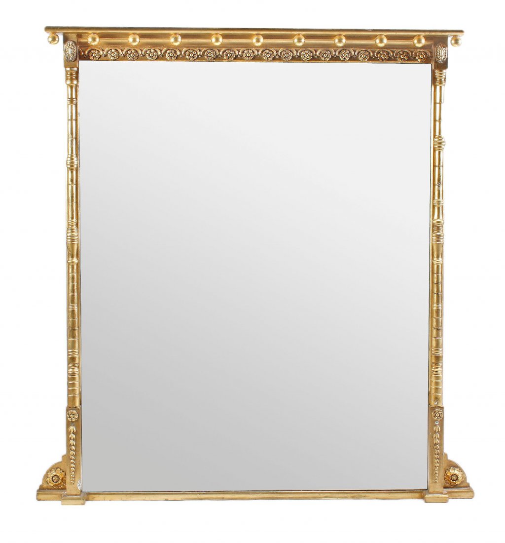 A Victorian giltwood and composition overmantle mirror: A Victorian giltwood and composition overmantle mirror , circa 1870, the sphere mounted cornice above a repeated flowerhead decorated frieze flanked by turned pilasters and bellflower decorated square