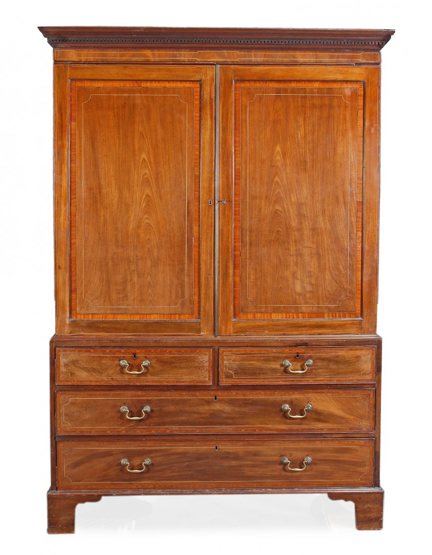 A George III mahogany and satinwood crossbanded clothes: A George III mahogany and satinwood crossbanded clothes press, circa 1780inlaid with boxwood stringing throughout, the moulded and dentil cornice, above a pair of field panelled cupboard doors opening