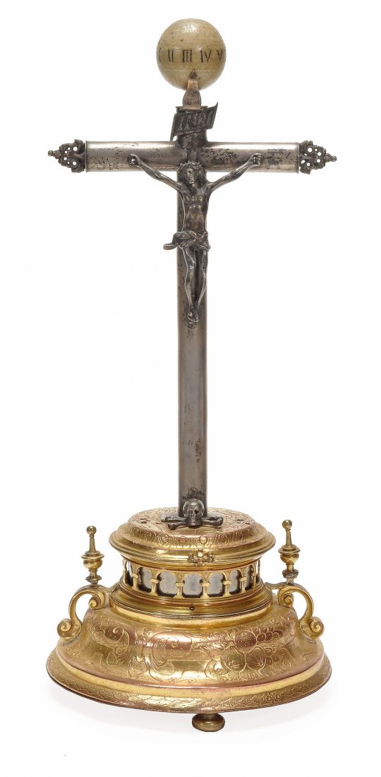 A German gilt copper and brass crucifix clock: A German gilt copper and brass crucifix clock Attributed to Hans Schlottheim, Augsburg, circa 1600 and later The circular gilt brass full plate verge movement with scroll engraved standing barrels for