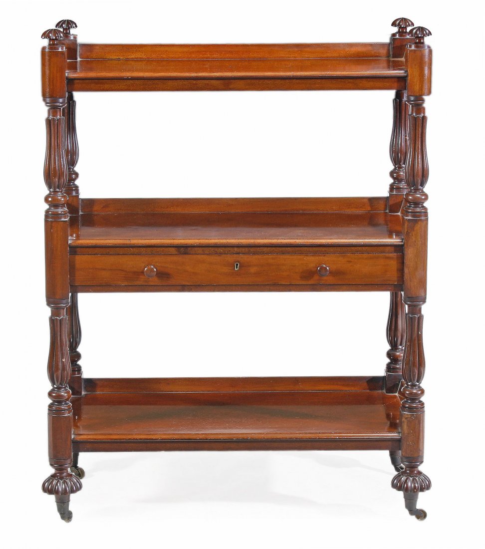 A William IV mahogany buffet, circa 1835, with three: A William IV mahogany buffet, circa 1835, with three shelves and incorporating a drawer, with gadrooned supports, on turned feet,122cm high, 92cm wide, 43cm deep W.Priest?