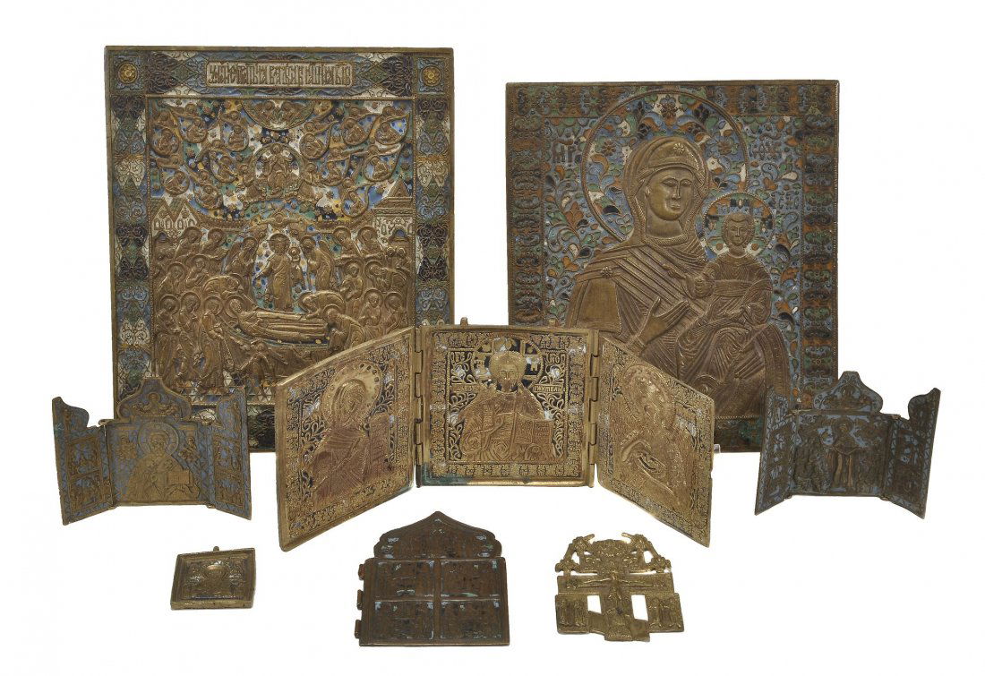 A collection of Russian brass icons and related items,: A collection of Russian brass icons and related items, compsiring: two champleve enamelled icons, one the Dormition of the Virgin, 29cm x 24.5cm; the other the Mother of God, 26.5cm x 23.5cm; three ch