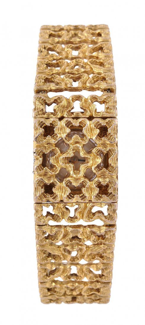 Girard Perregaux, a lady's 18 carat gold bracelet: Girard Perregaux, a lady's 18 carat gold bracelet wristwatch, circa 1970, ref. 11881C, the three piece pierced case and bracelet with rolled gold case back, the silvered dial with raised baton numeral