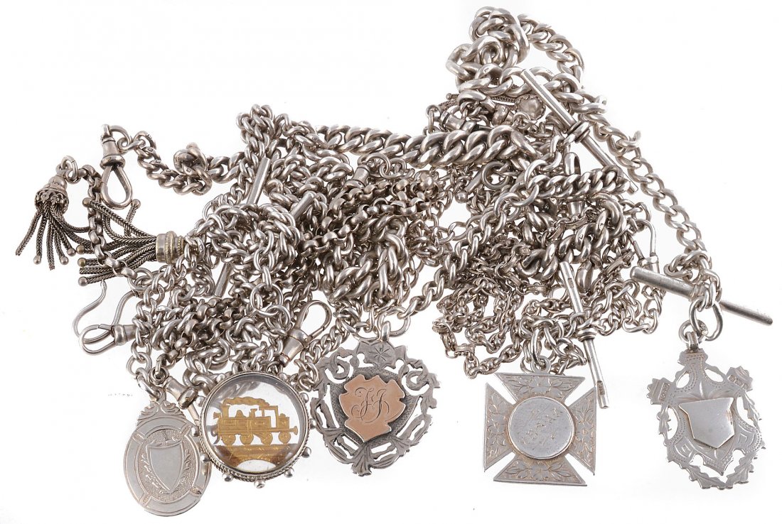A collection of silver coloured Albert chains: A collection of silver coloured Albert chains, including various curb link chains; a fancy link chain; and a belcher link chain; some suspending fobs, gross weight 291g