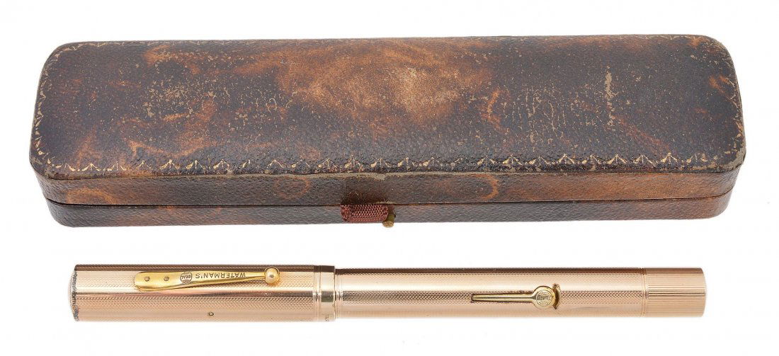 Waterman's, Ideal, a gold plated fountain pen: Waterman's, Ideal, a gold plated fountain pen, with engine turned ribbing to the cap and barrel, the nib stamped ct', with a lever filling system, inked