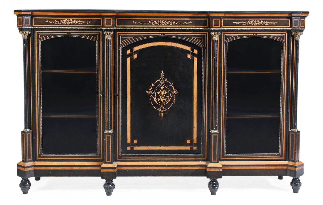 A Victorian ebonised and marquetry decorated credenza,: A Victorian ebonised and marquetry decorated credenza, circa 1870, with a central cupboard flanked on either side by glass fronted cupboards opening to shelves, 115cm high, 180cm wide, 44cm deep