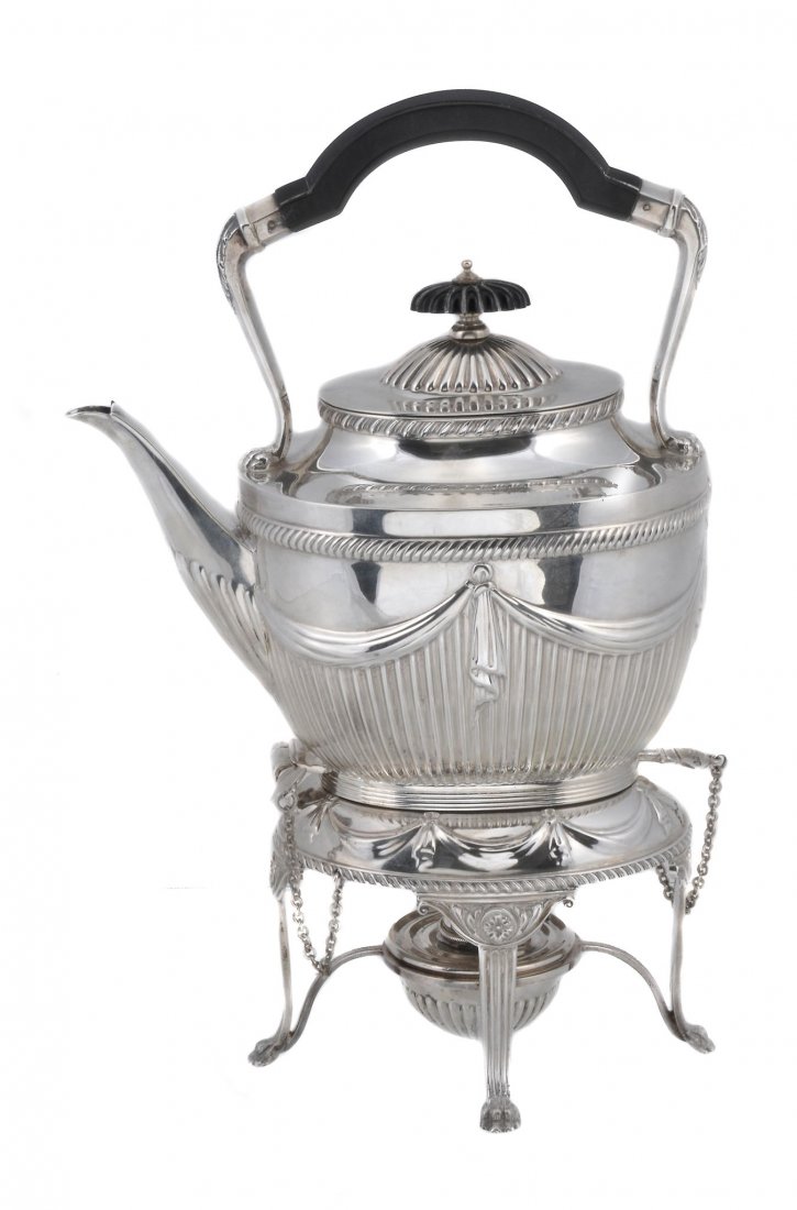 A late Victorian silver tea kettle on stand by The: A late Victorian silver tea kettle on stand by The Goldsmiths & Silversmiths Co. Ltd. (William Gibson & John Lawrence Langman), London 1898, with a composition handle and lobed finial to the domed cov