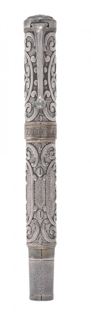 Aurora, Benvenuto Cellini, a limited edition silver: Aurora, Benvenuto Cellini, a limited edition silver fountain pen, no 0785/1919, with an engraved cap and barrel, stamped 925 with Italian control marks, the nib stamped 18K, with a piston filling syst