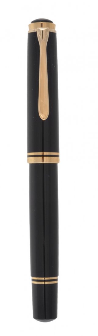 Pelikan, M1000, a black lacquer fountain pen: Pelikan, M1000, a black lacquer fountain pen, the black lacquer cap and barrel with gilt trim, the two colour nib stamped 18C, with a piston filling system, in a Pelikan box with ink and outer card sl