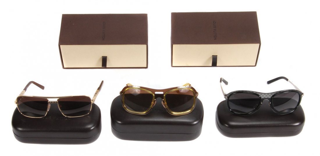Louis Vuitton, three pairs of sunglasses , one frame in: Louis Vuitton, three pairs of sunglasses , one frame in gilt metal frame, serial number Z0259U; one frame in grey chequer pattern resin with white metal sides, serial number Z0423U; one frame in shade