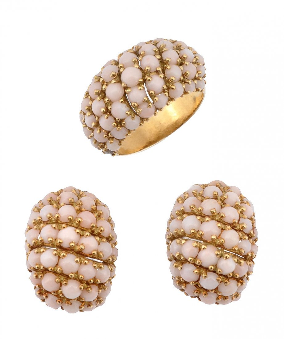 A 1960's coral suite of jewellery by Pomellato: A 1960's coral suite of jewellery by Pomellato, the band ring set with circular coral cabochons, stamped 750 with maker's mark for Pomellato and Italian control marks for Milan, finger size O 1/2; the