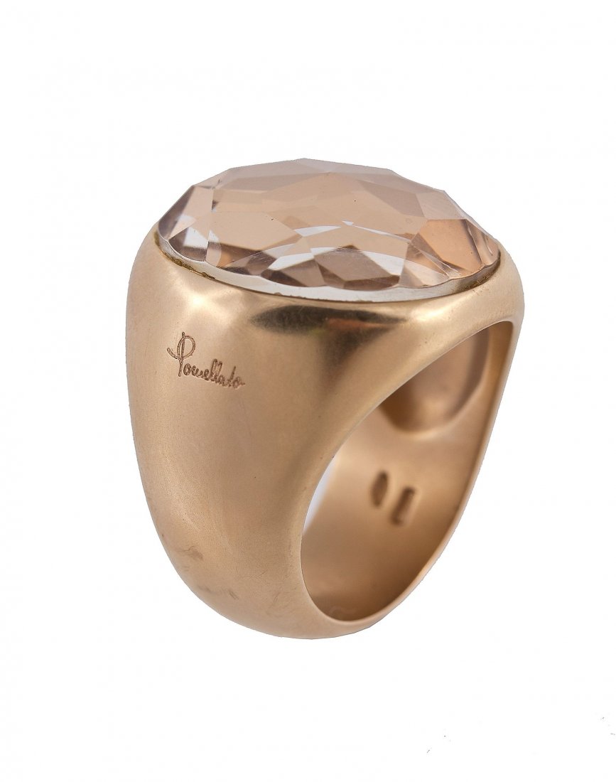 An 18 carat gold and smoky quartz ring by Pomellato: An 18 carat gold and smoky quartz ring by Pomellato, the fancy cut smoky quartz in a collet setting, signed Pomellato, stamped 750 with Italian control marks, finger size M