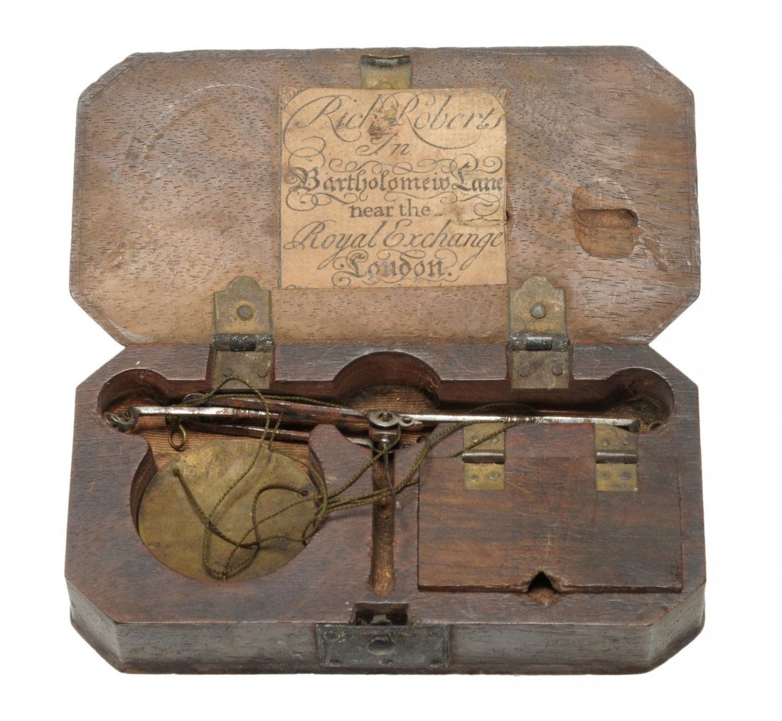 A set of pocket hand scales by Richard Roberts, Royal: A set of pocket hand scales by Richard Roberts, Royal Exchange London, 18th century , in a fitted shaped rectangular case with manufacturers paper label, enclosing three weights of various sizes, 10.5