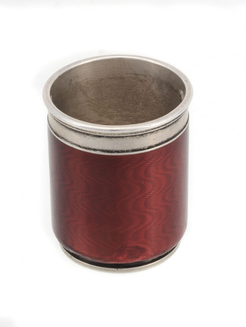 A Russian silver and red guilloche enamel cylindrical: A Russian silver and red guilloche enamel cylindrical vodka tot (charka) by Carl Faberge, workmaster August Holmstrom, 1896-1908 Kokoshnik mark, assay master Yakov Nikolayevich Lyapunov (1898-1903), 8