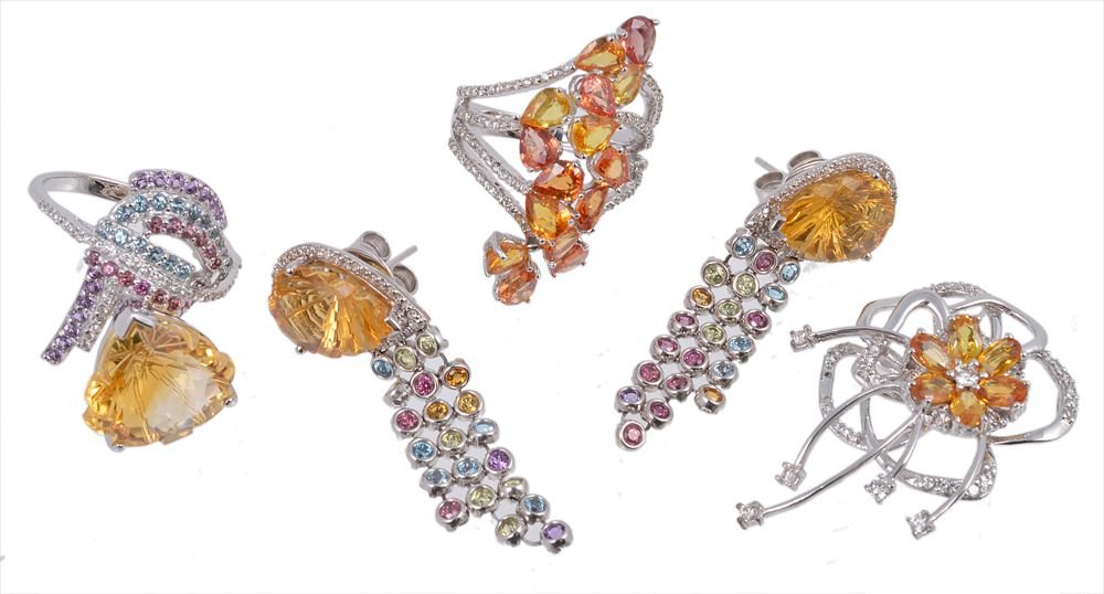 A yellow sapphire, orange sapphire and diamond ring: A yellow sapphire, orange sapphire and diamond ring, the pear shaped yellow and orange sapphires to shoulders set with brilliant cut diamonds, stamped 750, finger size K; a further multi gem set ring;