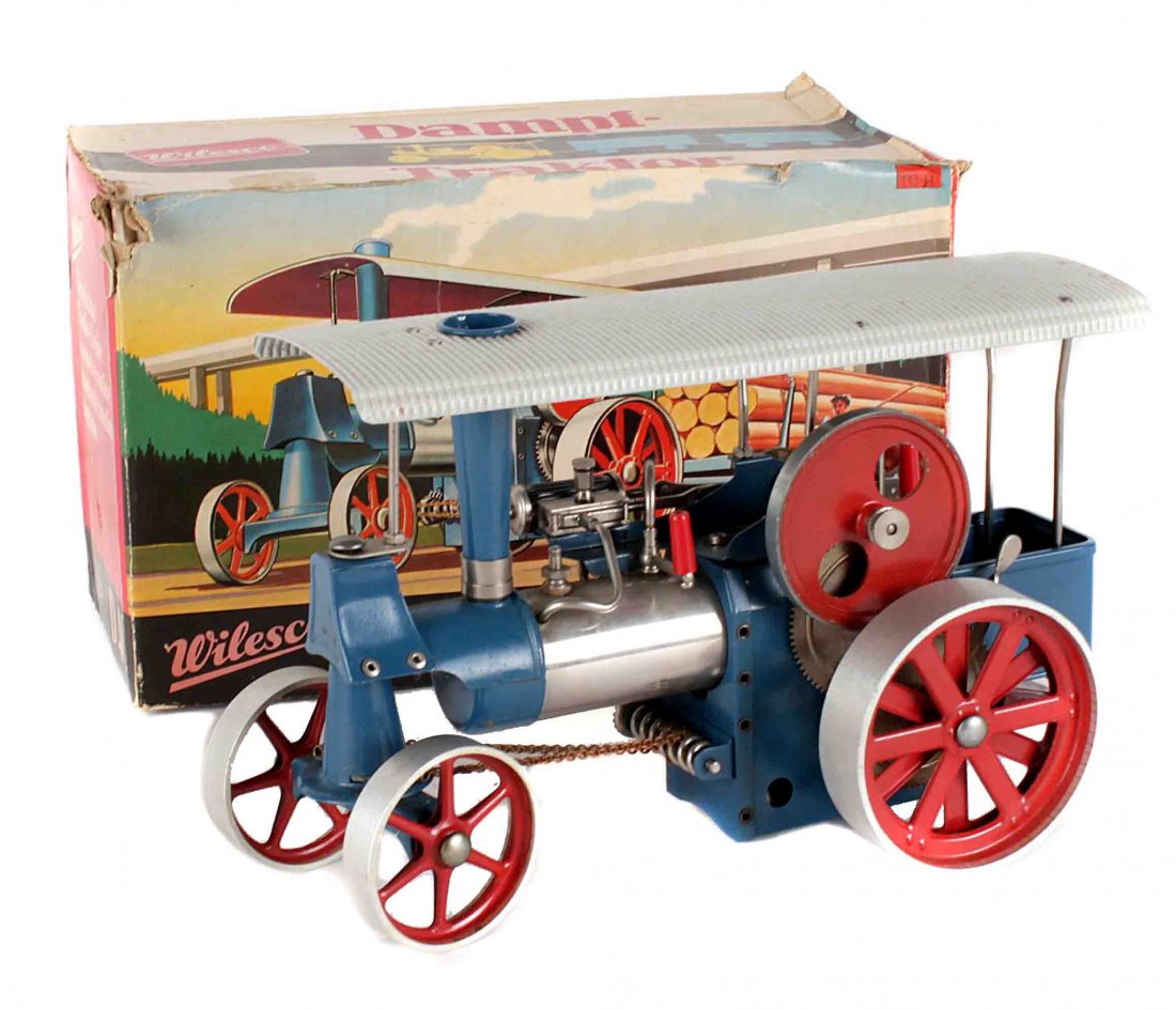 A Wilesco D40 spirit fired traction engine: A Wilesco D40 spirit fired traction engine, with canopy and original flexible steering gear, boxed (very little wear).