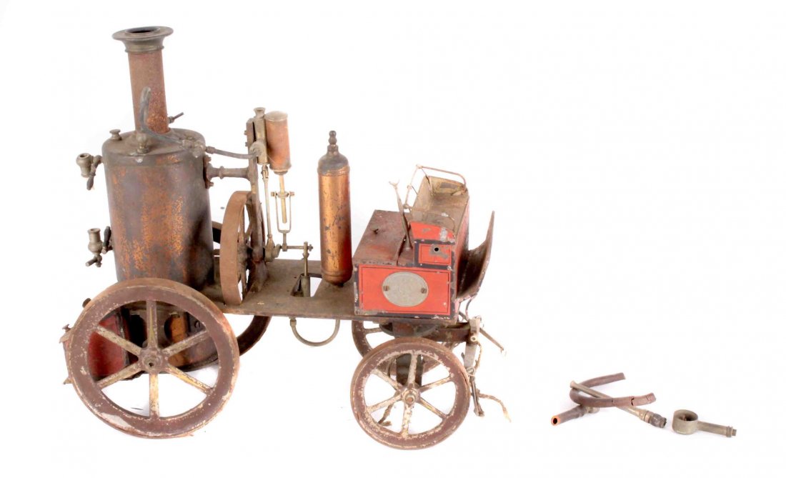 An Ernst Plank tinplate horse drawn fire engine, with: An Ernst Plank tinplate horse drawn fire engine, with original paintwork (in rusty condition), the vertical spirit fired boiler (damaged sight glass), burner present, steam supply pipe and control to 