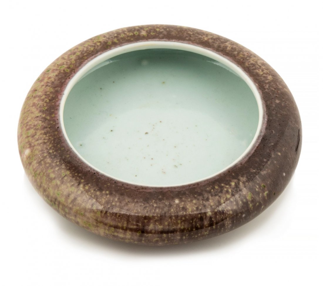 A peach bloom glazed brush washer, Kangxi six character: A peach bloom glazed brush washer, Kangxi six character mark but 19th century , of compressed globular form, the exterior covered with a glaze of crushed purplish tone thinning in areas to mushroom, w