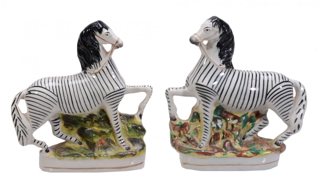 Two Staffordshire models of zebras, mid 19th century,: Two Staffordshire models of zebras, mid 19th century, 22cm & 22.5cm high, paper labels for Jaqueline Oosthuizen Antiques