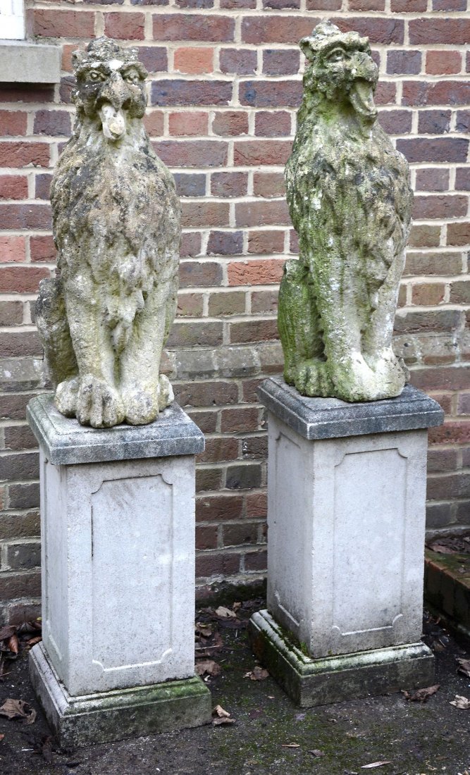 A pair of Victorian reconstituted stone pier finials ,: A pair of Victorian reconstituted stone pier finials , cast as seated gryphons, second half 19th century, 78cm high; later mounted on reconstituted stone plinths, 70cm high