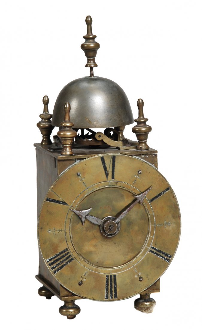 An Italian iron and brass small chamber clock Unsigned: An Italian iron and brass small chamber clock Unsigned, circa 1700 and later The two train weight-driven posted countwheel bell striking movement with verge escapement mounted above the top plate regu