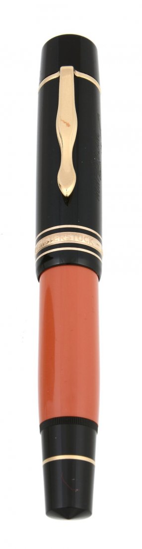 Montblanc, Writers Edition, Ernest Hemingway, a limited: Montblanc, Writers Edition, Ernest Hemingway, a limited edition fountain pen, issued in 1992, with a red resin barrel and dark brown resin cap, and engraved with Hemingway's facsimile signature, the n