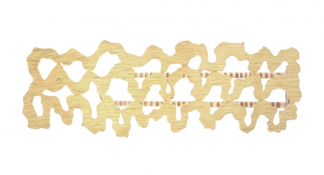 An 18 carat gold money clip by Andrew Grima, of pierced: An 18 carat gold money clip by Andrew Grima, of pierced textured design, signed Grima, stamped 750 with full London hallmarks for 1970, 6.6cm long