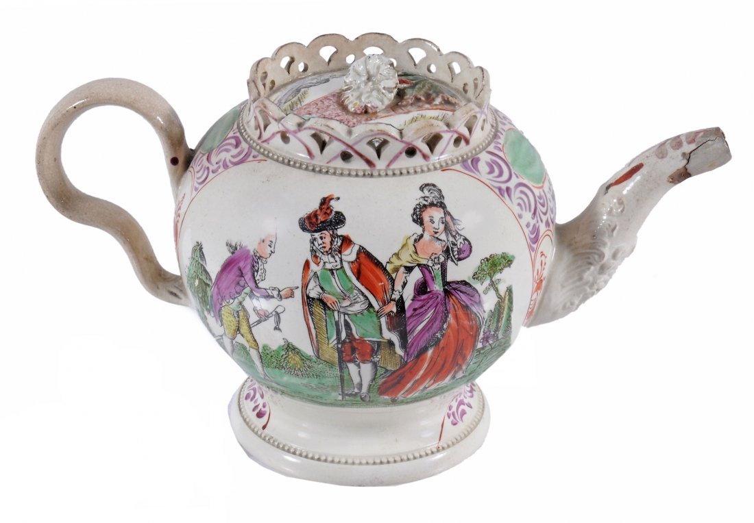 A Staffordshire creamware teapot and cover of: A Staffordshire creamware teapot and cover of Greatbatch type , circa 1775, the globular body with pierced gallery rim and leaf-moulded spout, printed and coloured with Harlequin and Columbine, the re