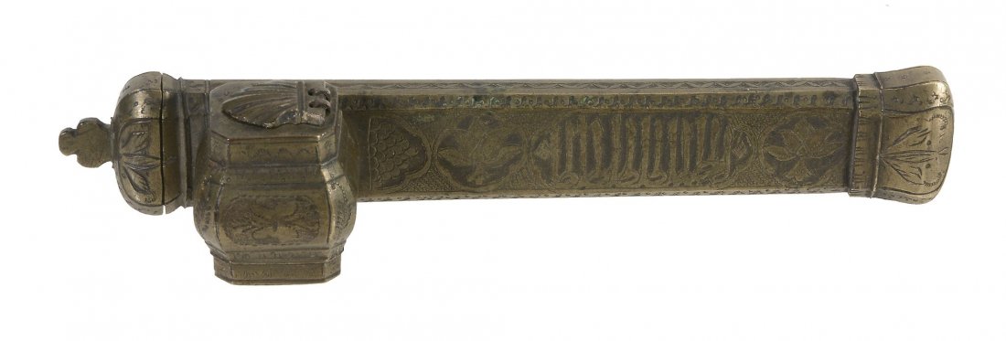 An Islamic brass scribes pen case, probably Syrian or: An Islamic brass scribes pen case, probably Syrian or Turkish, with engraved calligraphy and foliage, shell inkwell cover, 22.5cm long