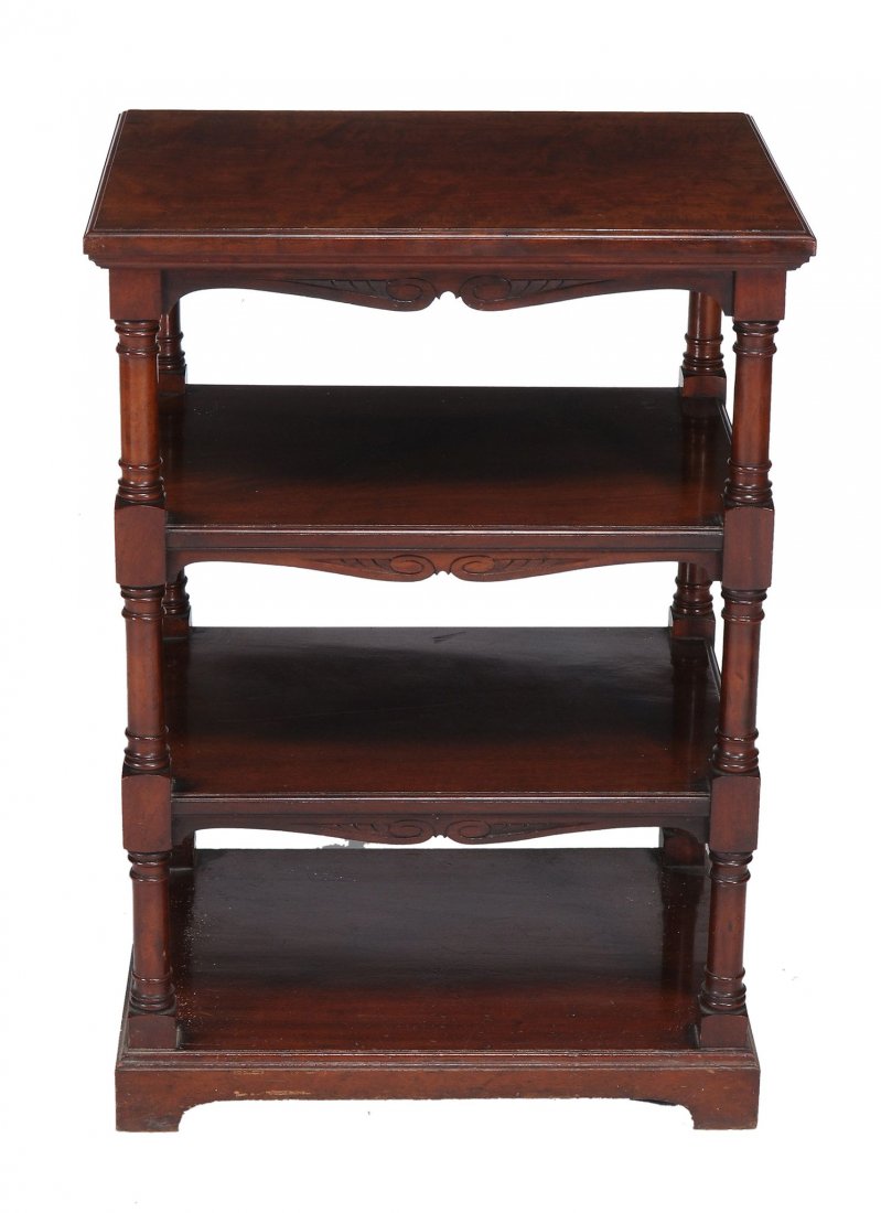 A Victorian mahogany four tier whatnot by W: A Victorian mahogany four tier whatnot by W.WALKER & SONS, circa 1890, bearing an ivorine makers label, each tier with a moulded edge and twin scroll frieze, supported by turned pillers and on bracket