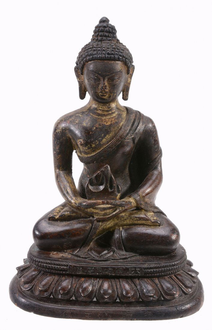 A gilt bronze seated figure of a Buddha , seated on (1 of 1)