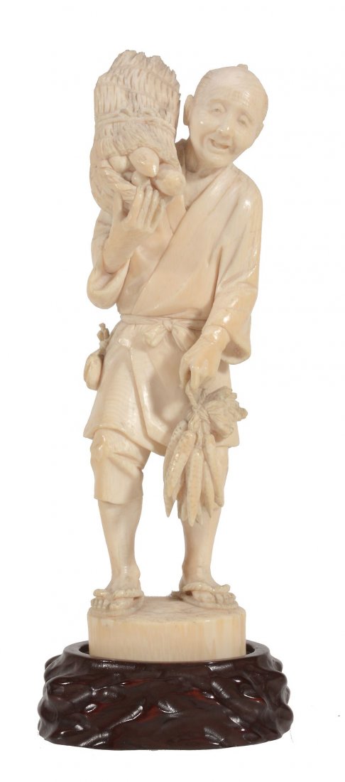 A Japanese Ivory Okimono of a Daikon Seller (1 of 2)