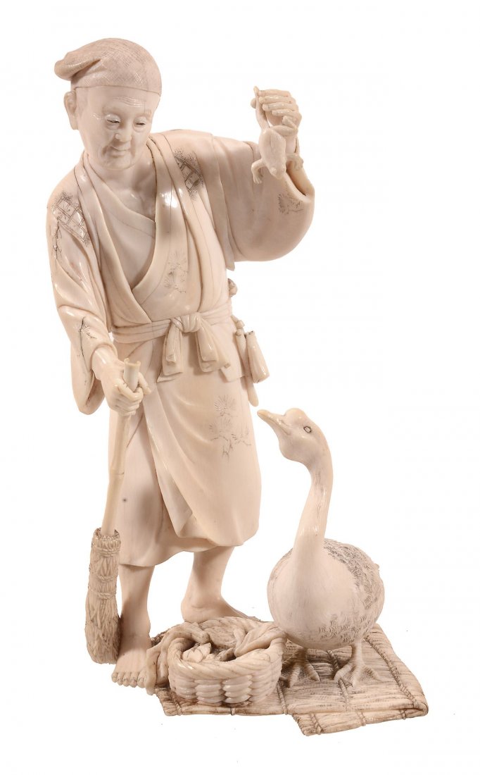 An Ivory Okimono of a Farmer and Goose, the man stands (1 of 2)