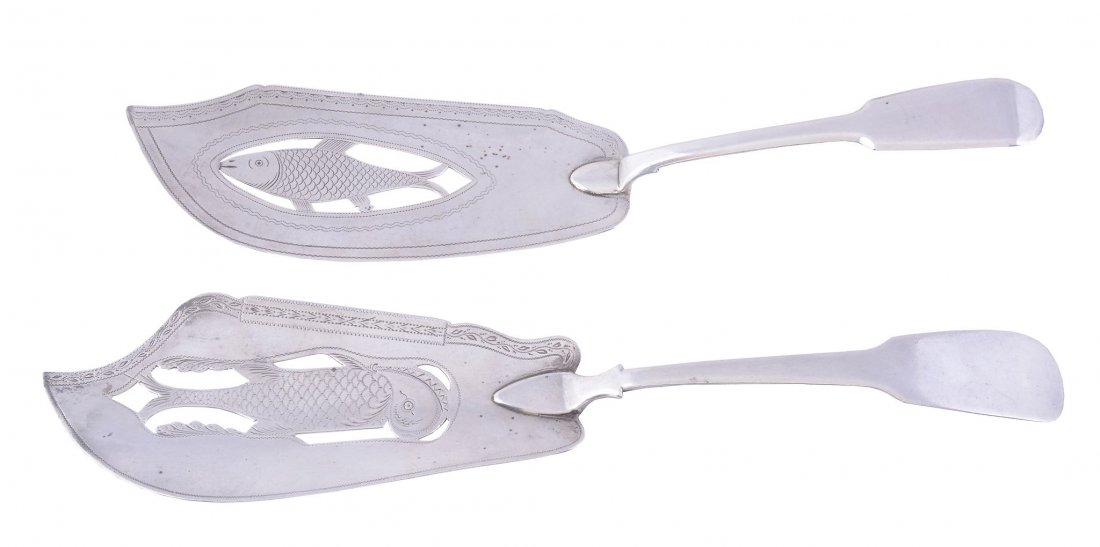 A George III silver fiddle pattern fish slice by: A George III silver fiddle pattern fish slice by William & Samuel Knight, London 1811, the blade pierced with a fish, 29cm long; and another similar by Thomas Johnson, London 1808, 31cm long, 224g (7.