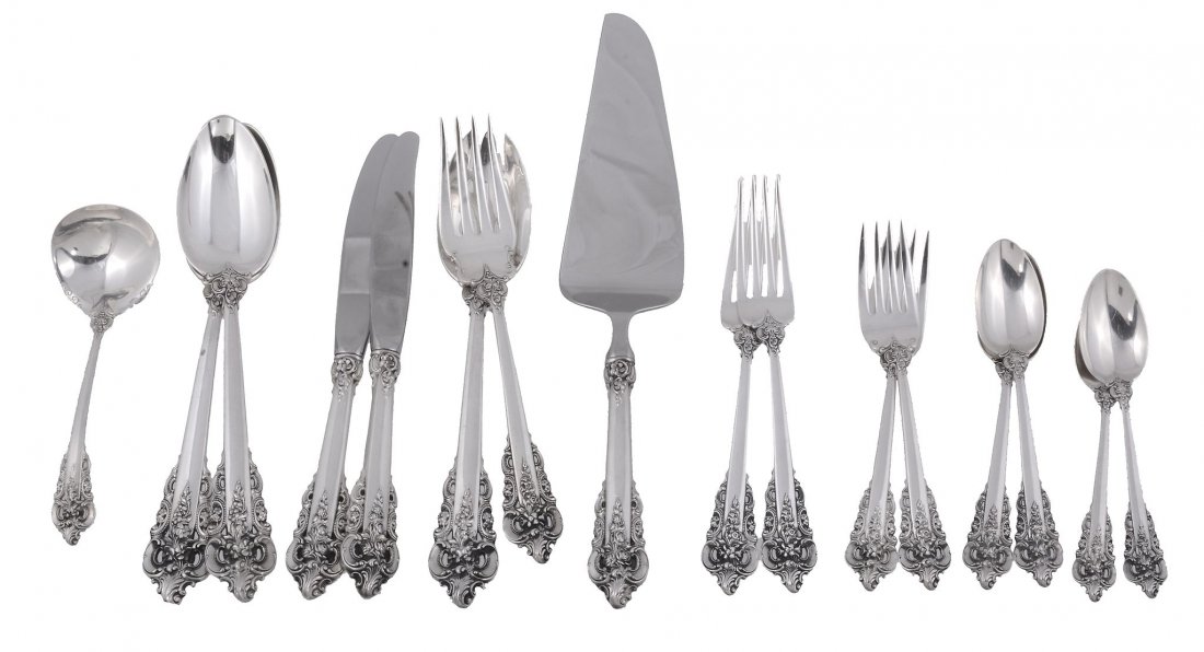 An American silver coloured Grande Baroque pattern: An American silver coloured Grande Baroque pattern table service by Wallace Silversmiths, mid 20th century, comprising: Twelve table forks Twelve dessert forks Twelve dessert spoons Eight tea spoons T