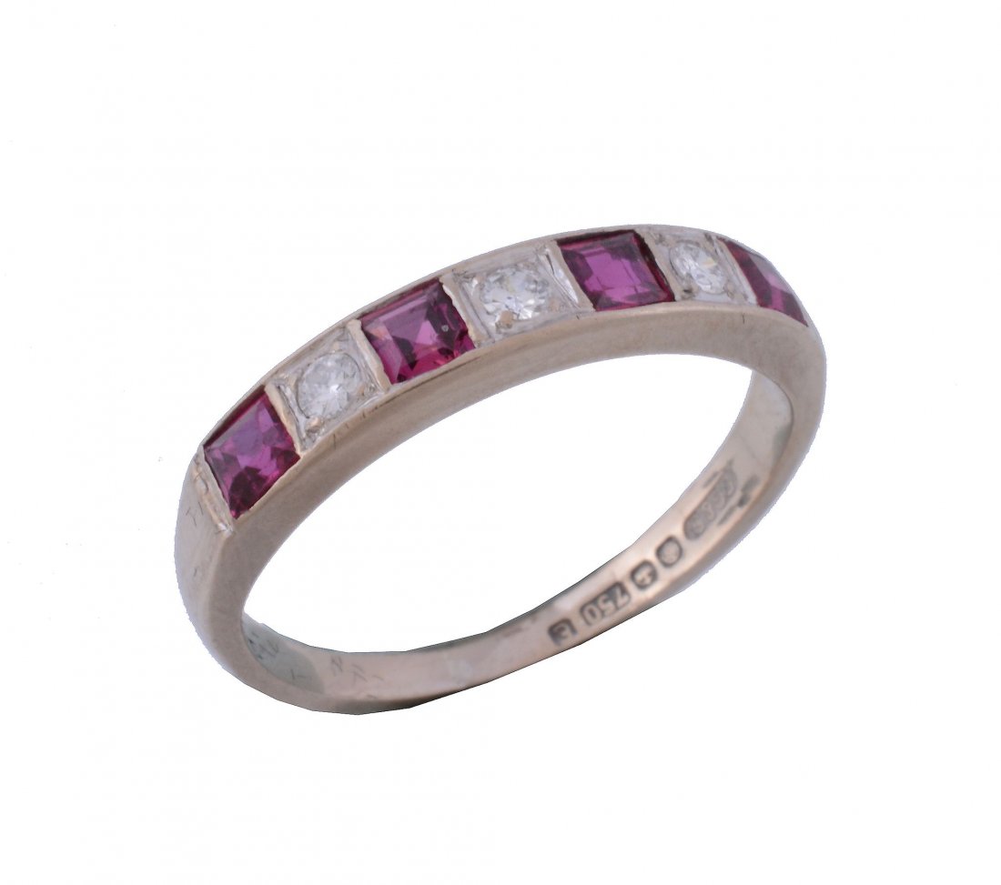 An 18 carat gold ruby and diamond ring, set with (1 of 3)