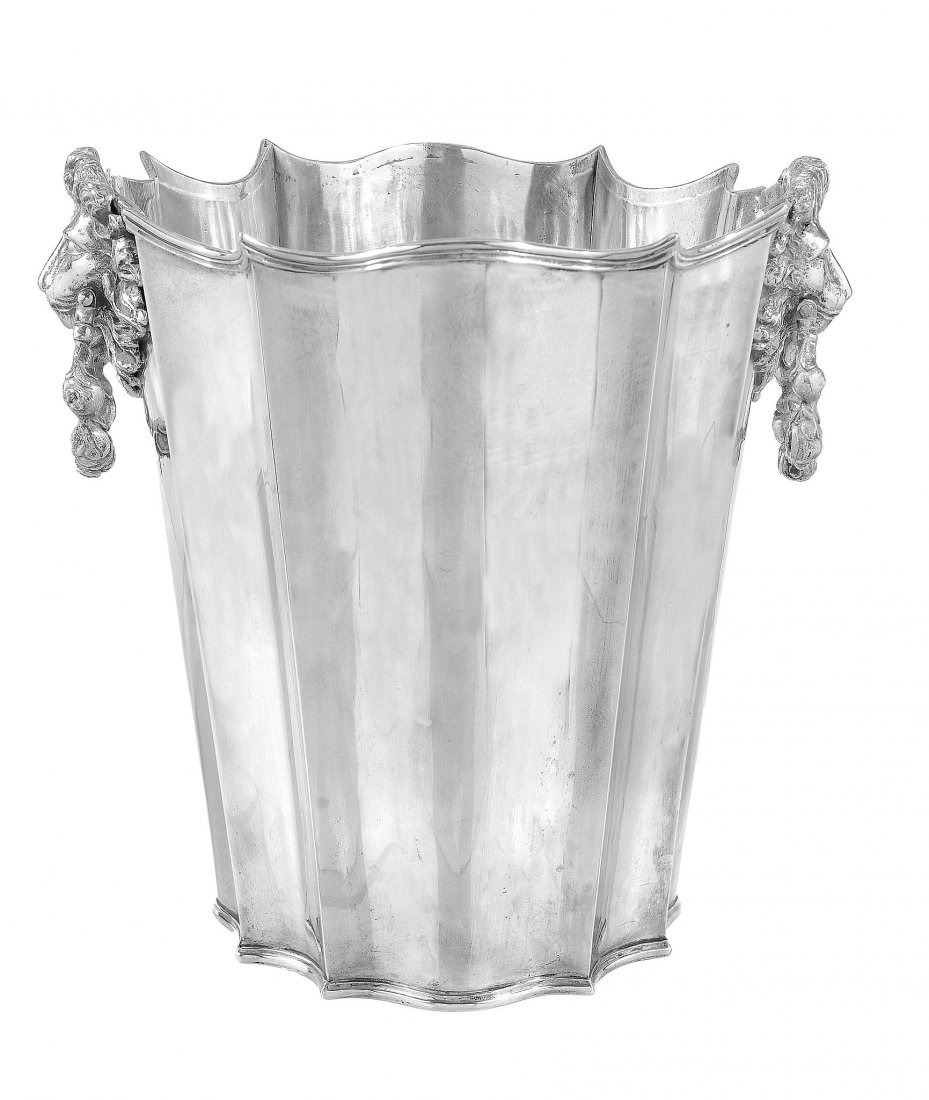 An Italian silver shaped circular wine cooler, Milan: An Italian silver shaped circular wine cooler, Milan 1934-1944, .800 standard, the slightly tapering body with lion mask and floral ring handles, 23cm (9in) high, 1428g (45.9 oz)